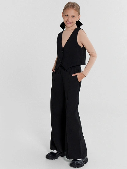 картинка Расклешенные брюки для девочек в черном цвете от известного бренда одежды для девочек Mark Formelle